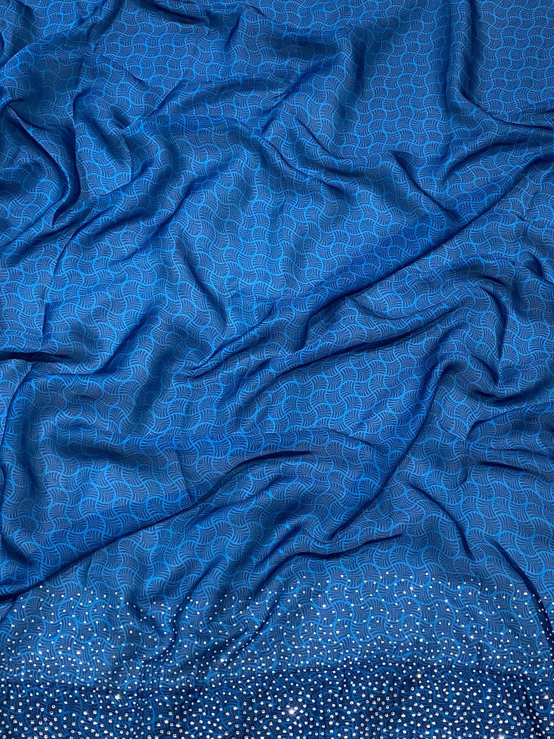 Close-up of blue patterned fabric with intricate design