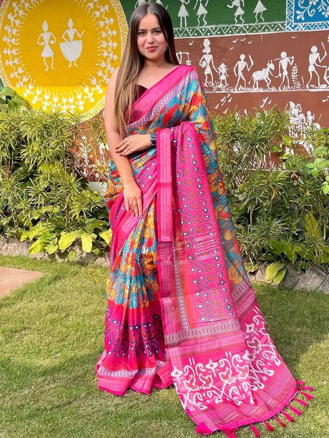 Model posing in floral Ikkat printed party wear saree outdoors