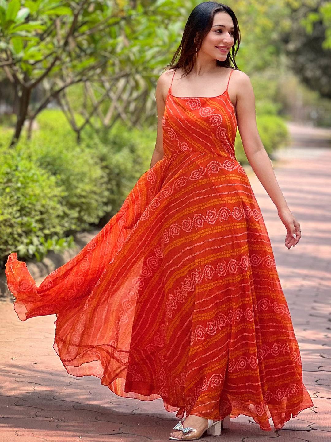 Model twirling in Portland Orange Bandhej Print Dress