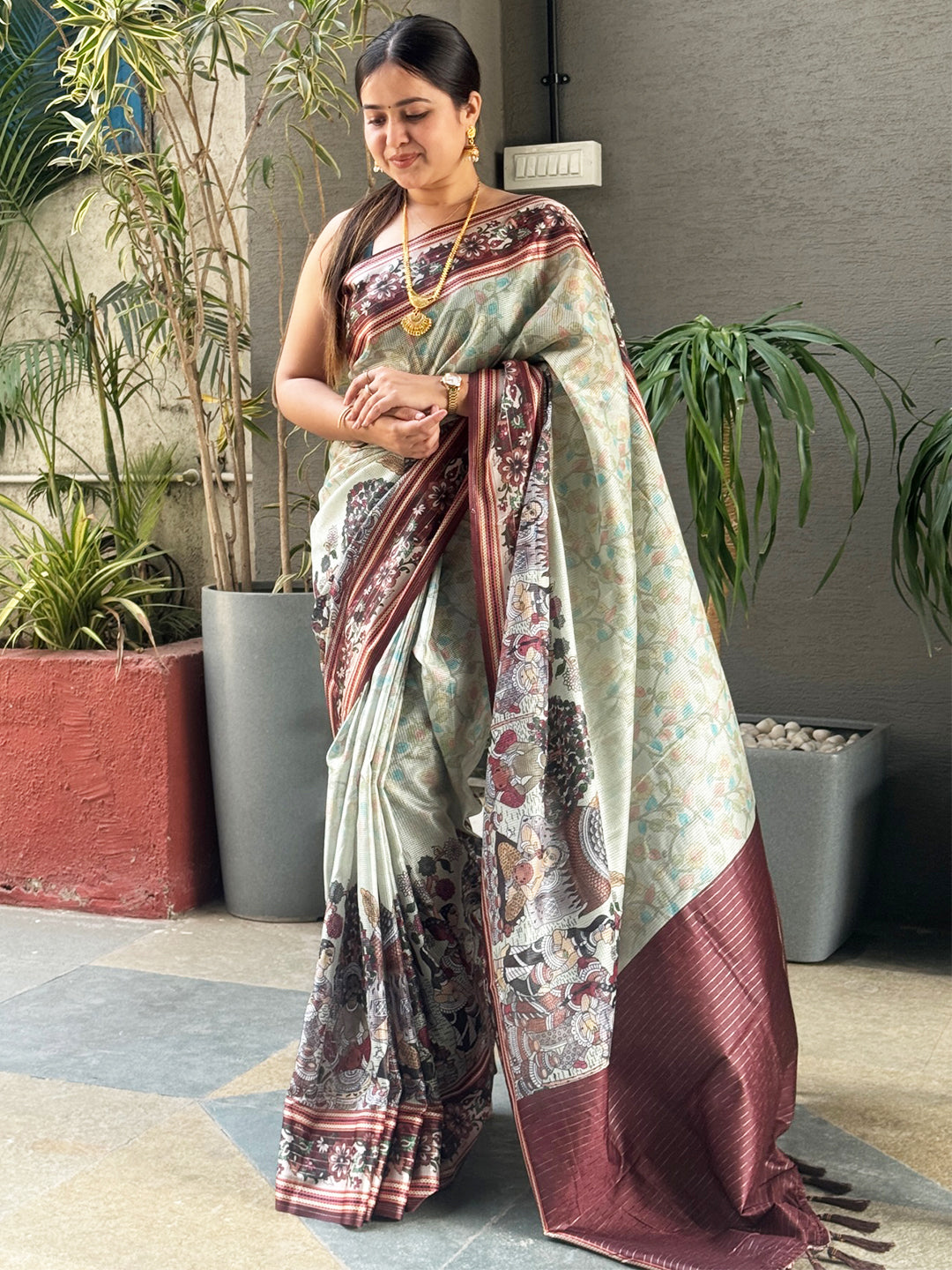 Model wearing Pista Colour Satin Kota Doria Saree with Zari Pallu