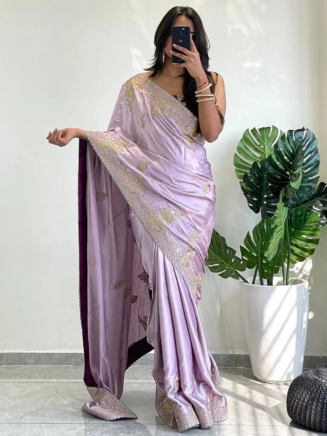 Model posing in silk saree with thread work border