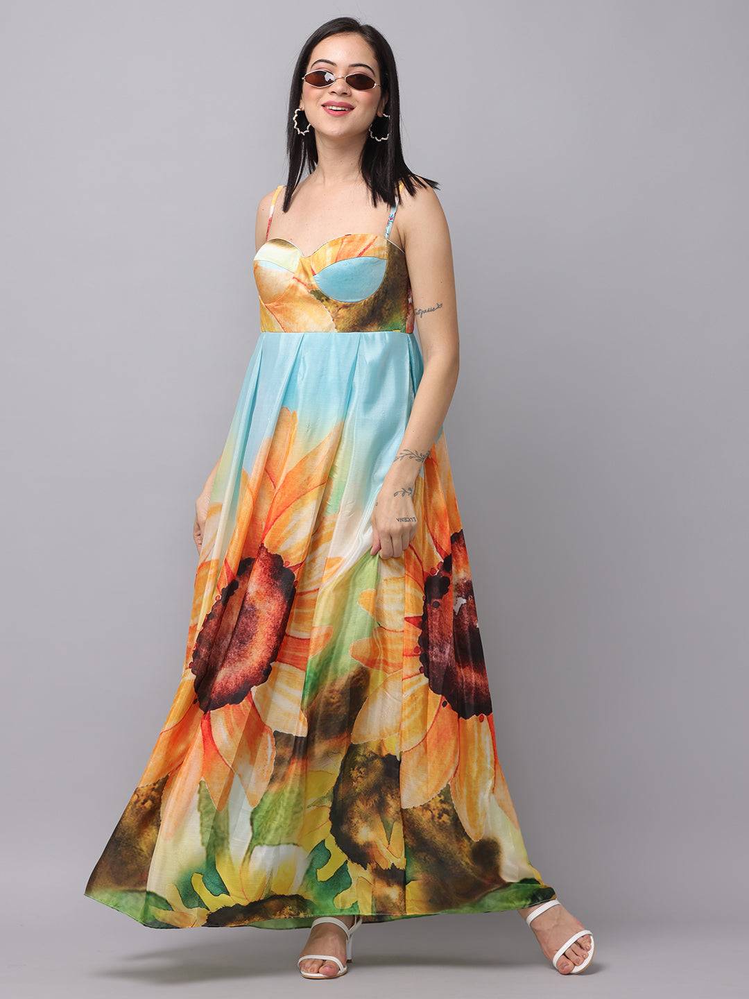 Model wearing multi-color floral print long dress with sunglasses