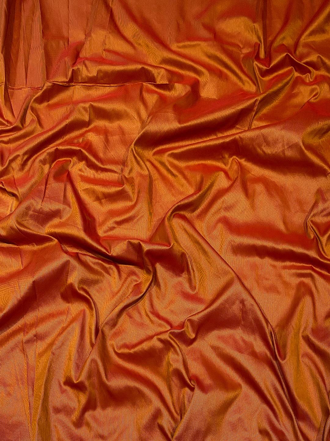 Close-up of orange soft silk fabric texture