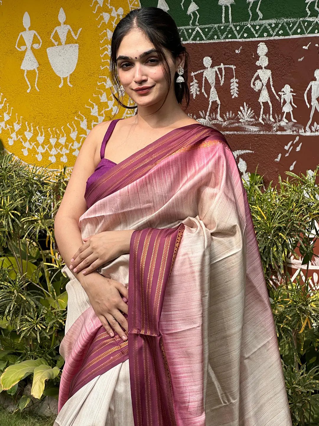 Close-up of woman in wine Ikkat Ghicha saree