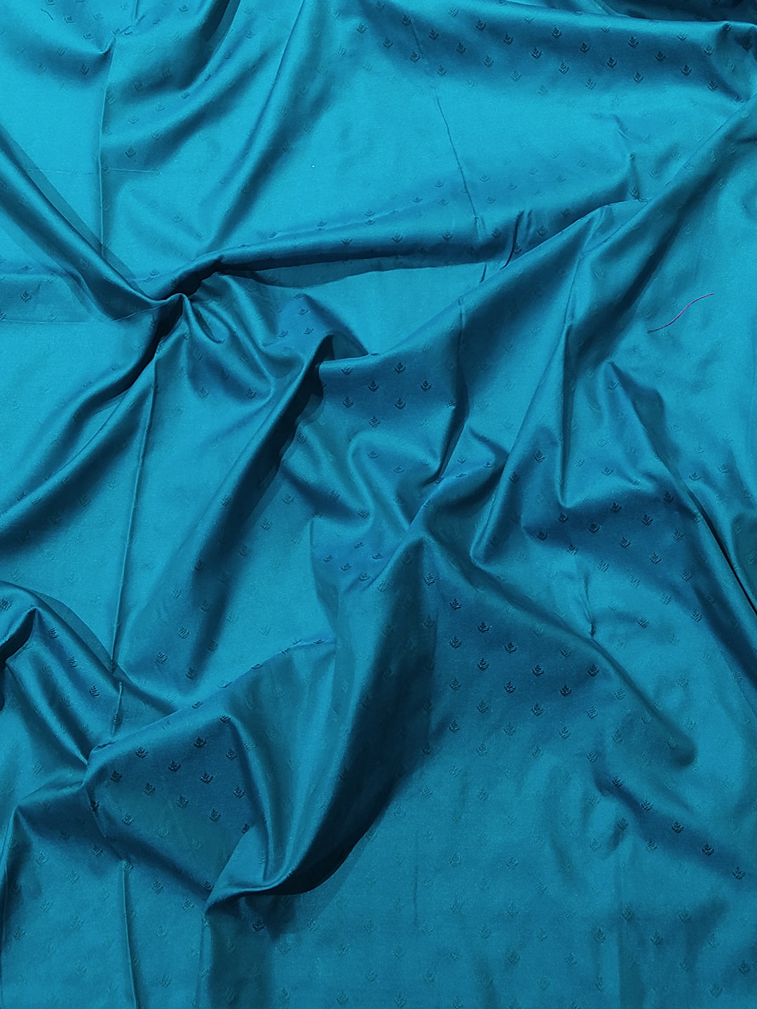 Teal fabric with subtle patterns for Kanjivaram saree