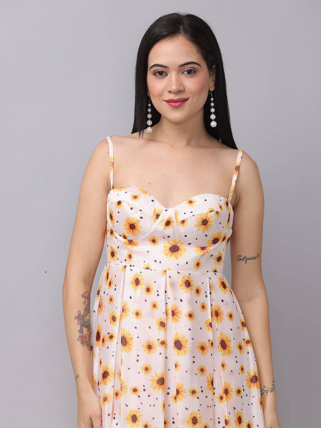 Close-up of white sunflower printed dress with sweetheart neckline.