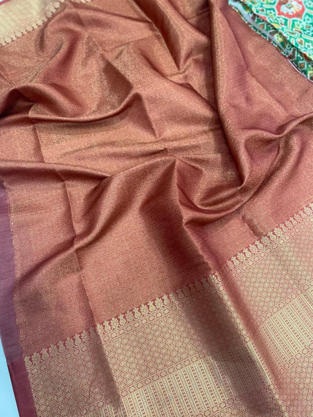 Close-up of Moonga Silk Kota Doriya saree with intricate Patola print.