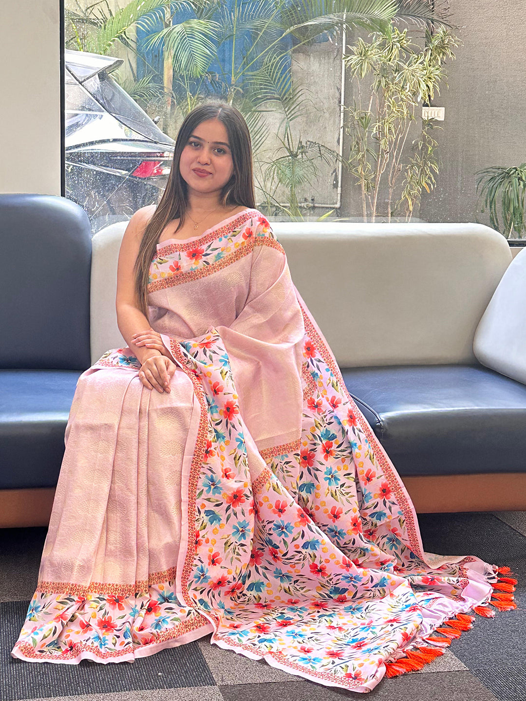 Light pink Kanjivaram saree with floral print, seated view