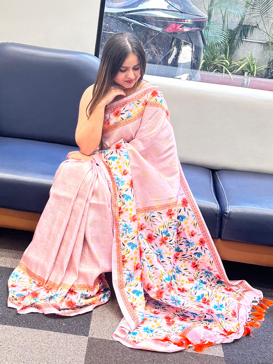 Light pink Kanjivaram saree with floral print, seated view