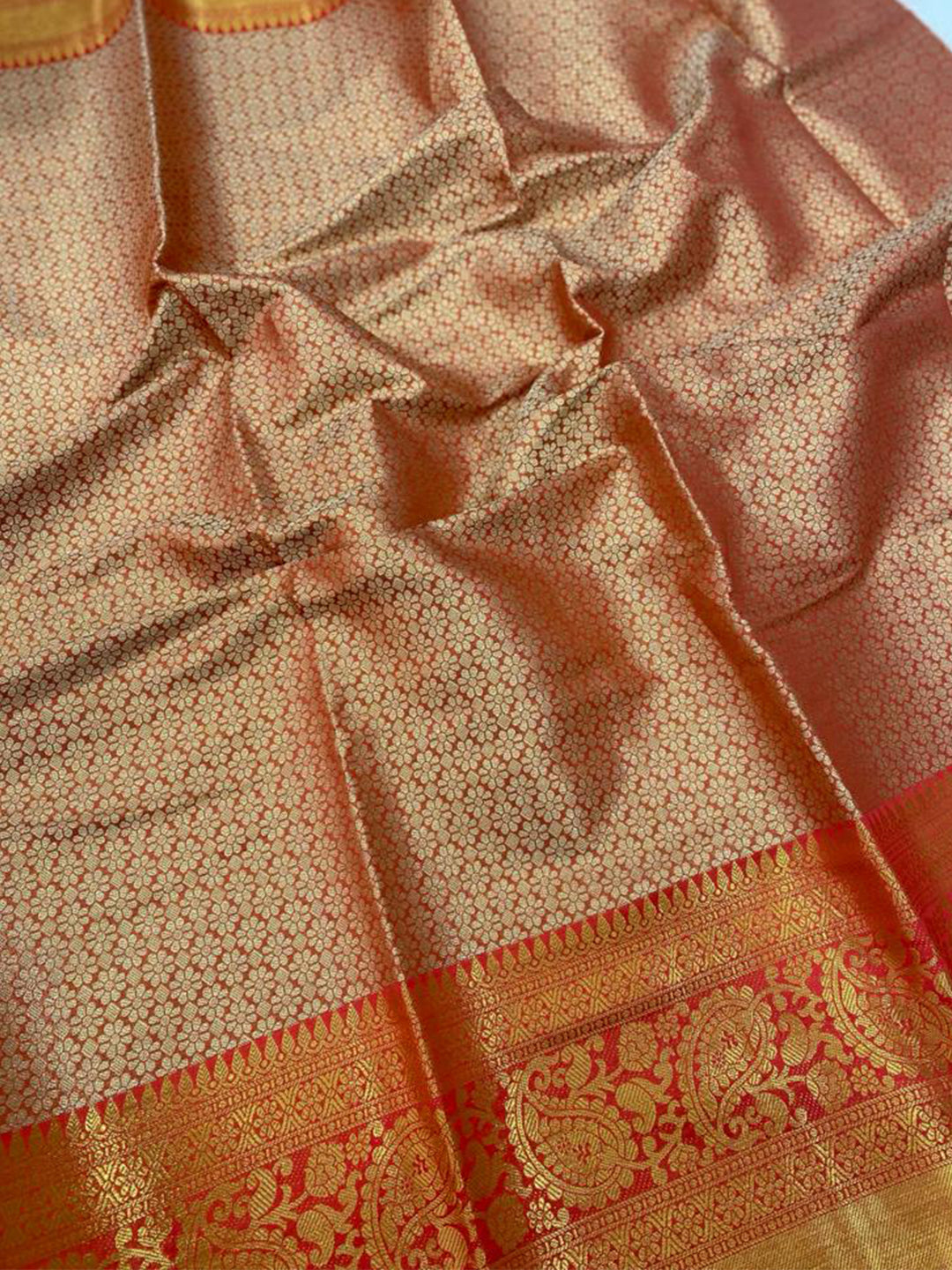 Close-up of gold zari work on Kanjivaaram pattu silk saree.