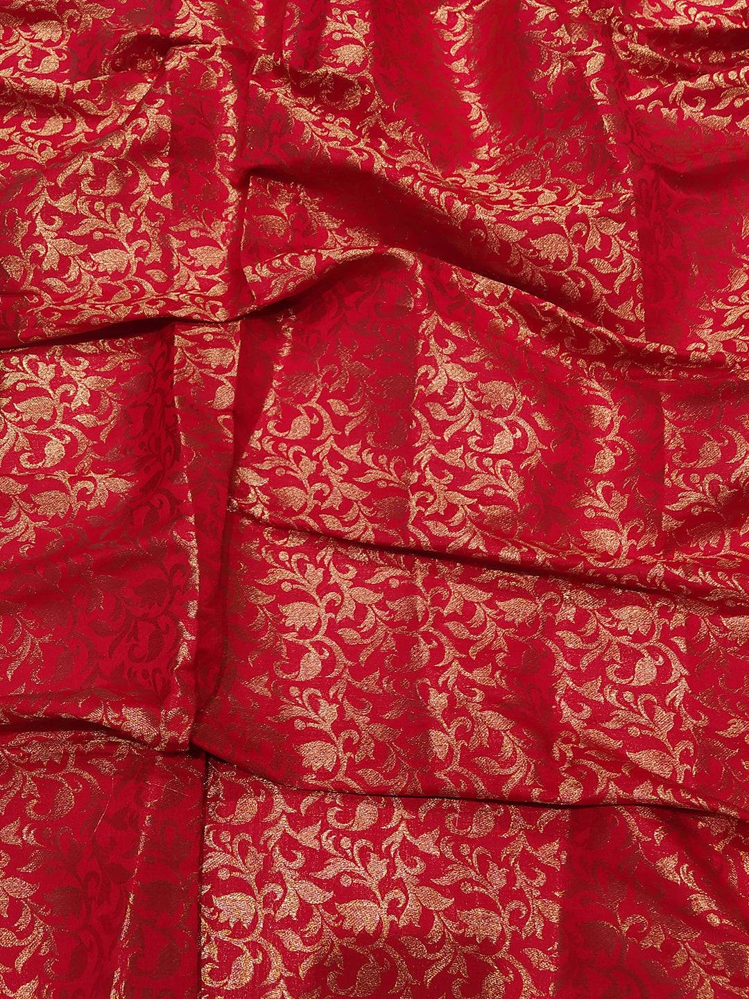 Close-up of red and gold Kanjivaram saree fabric design