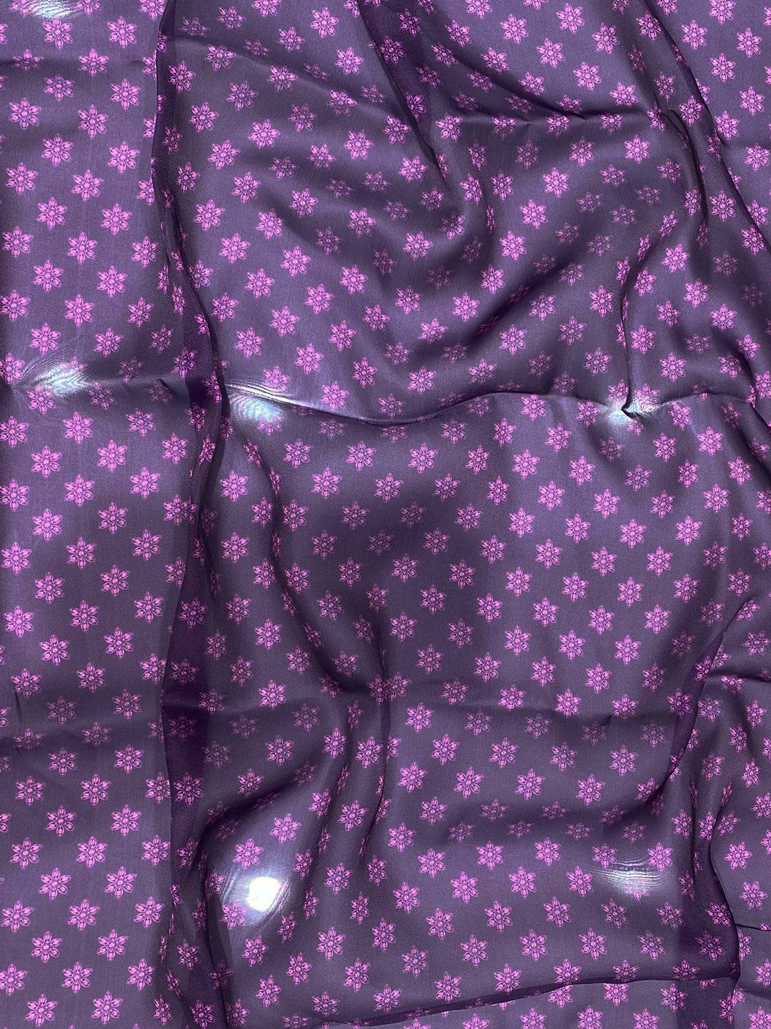 Close-up of purple satin georgette fabric with floral pattern