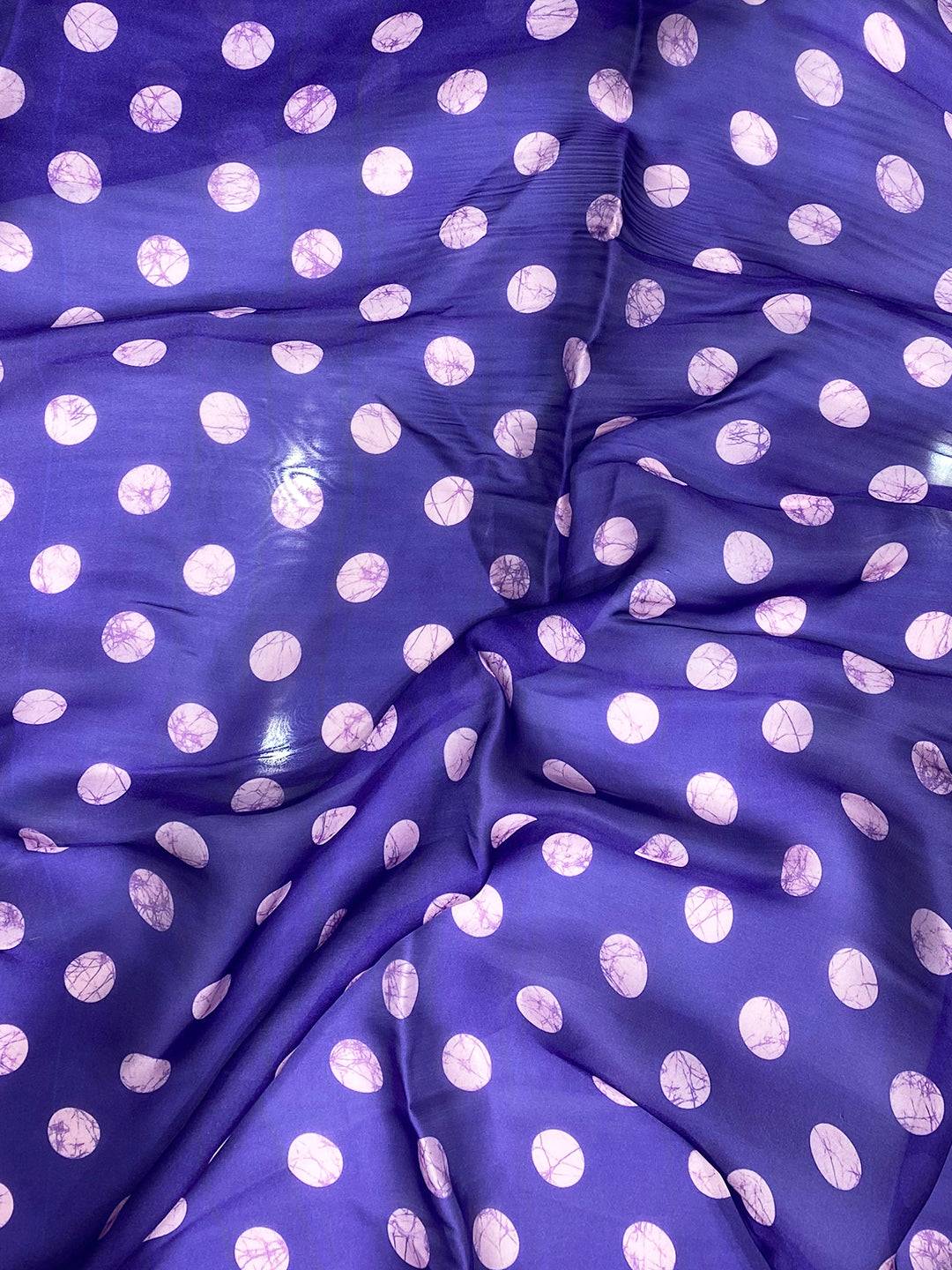 Close-up of purple polka dot blouse fabric