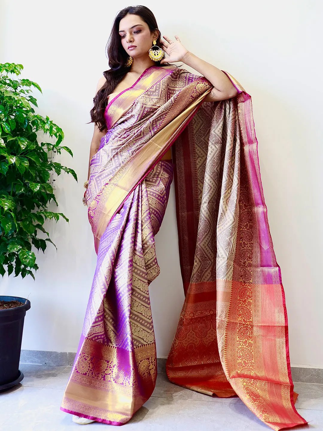 Traditional Kanjivaaram silk saree featuring gold zari details.