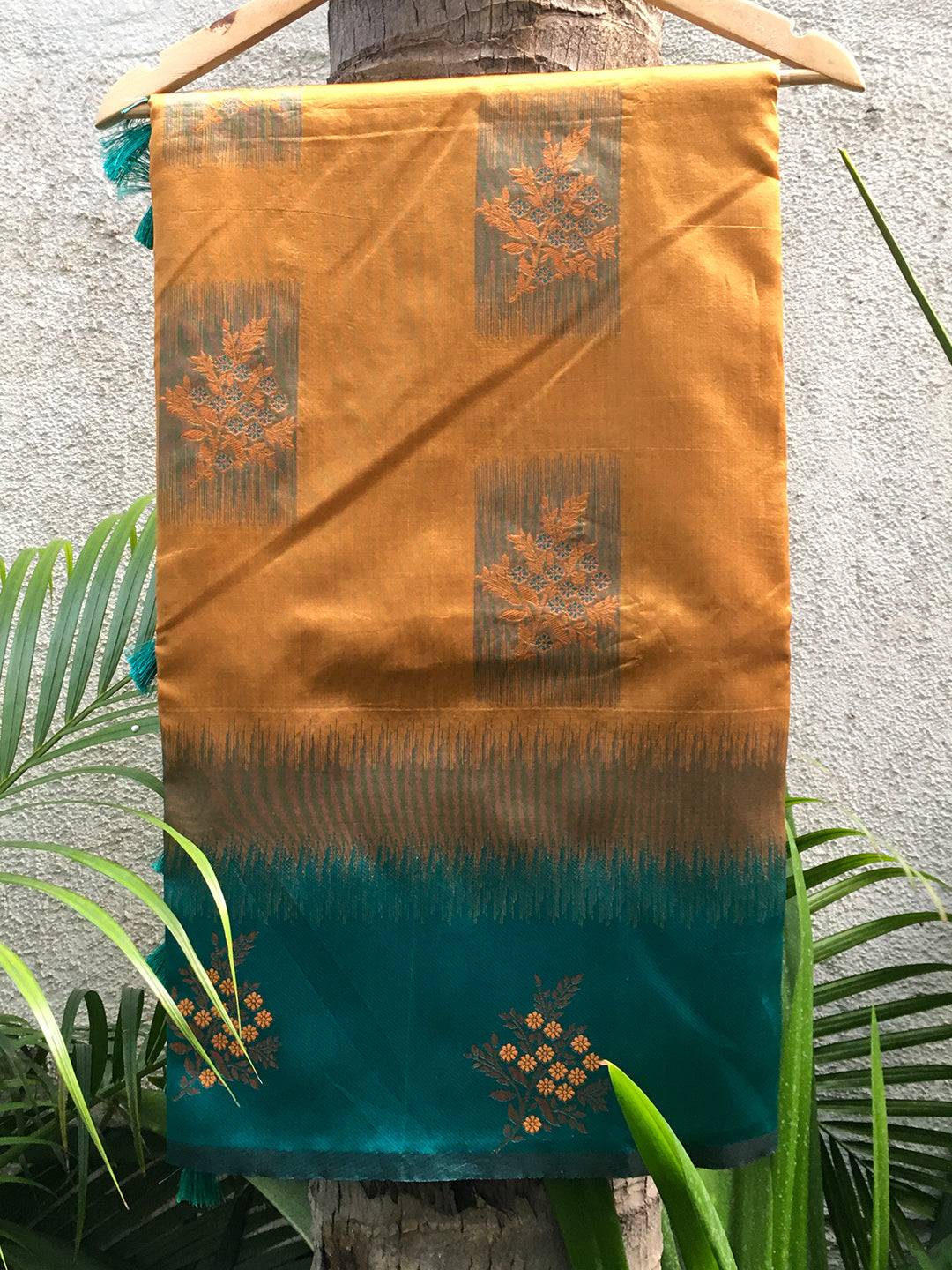 Mustard Sami Banarasi Tussar Silk Saree on display.