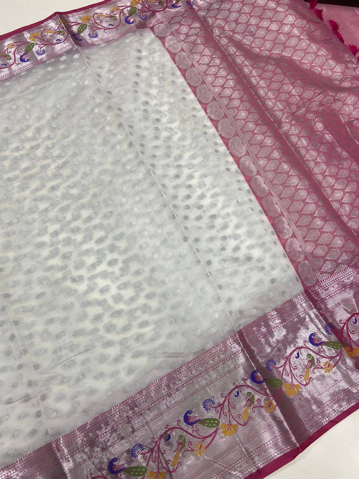 Elegant white pink organza saree showcasing silver zari patterns