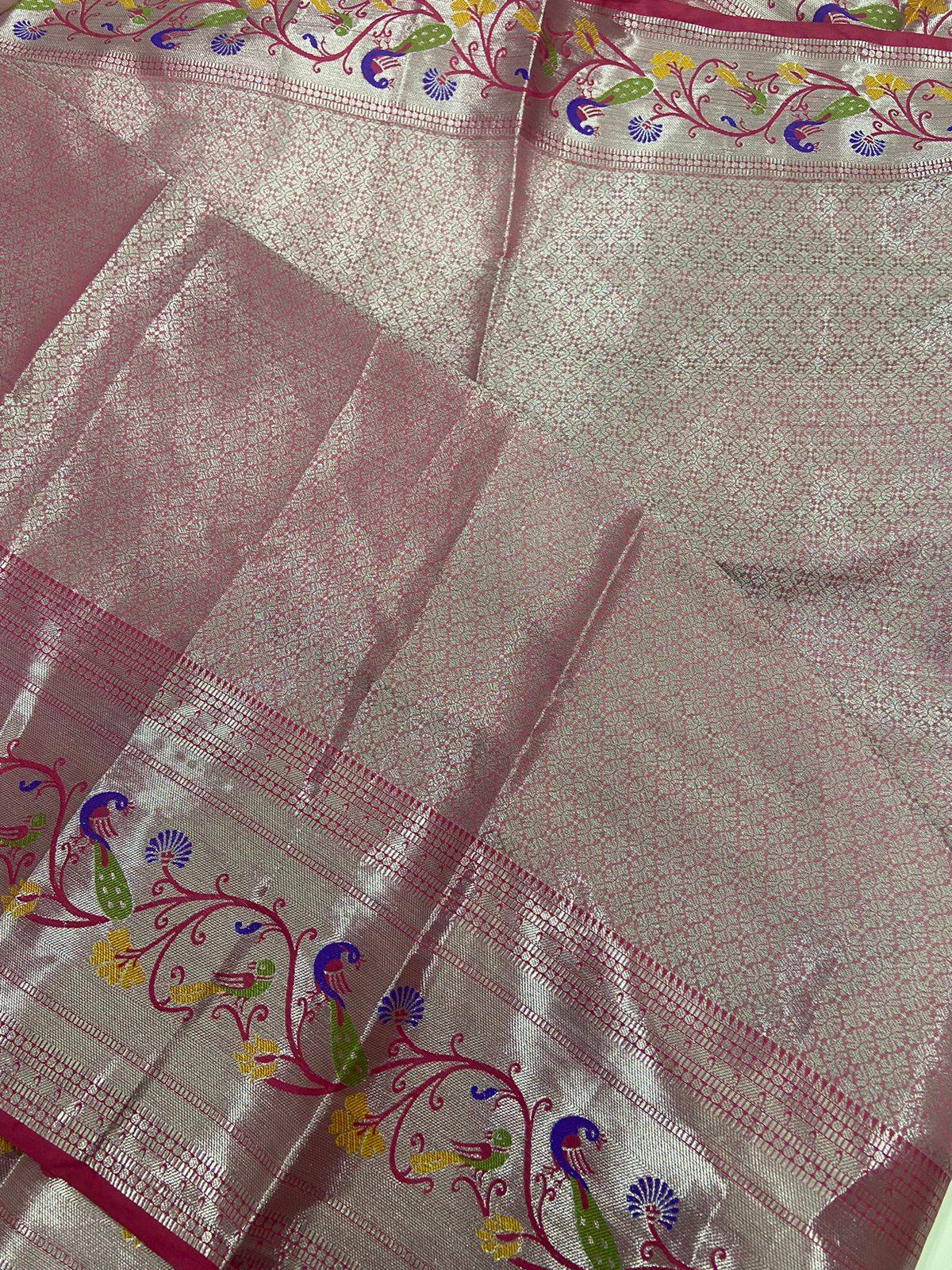 Detailed view of white pink organza saree with floral silver zari