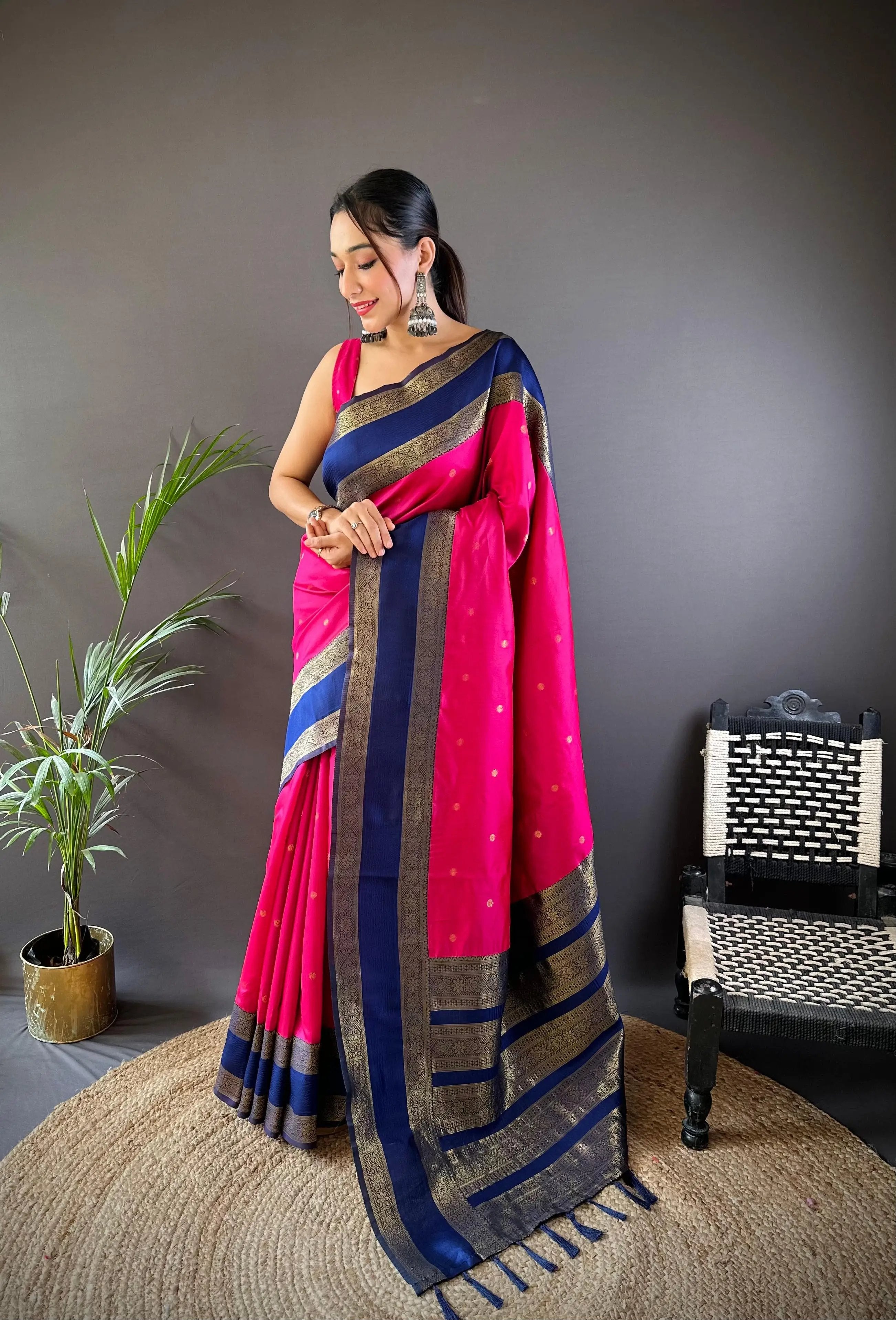 Elegant pink and blue Banarasi saree with gold accents