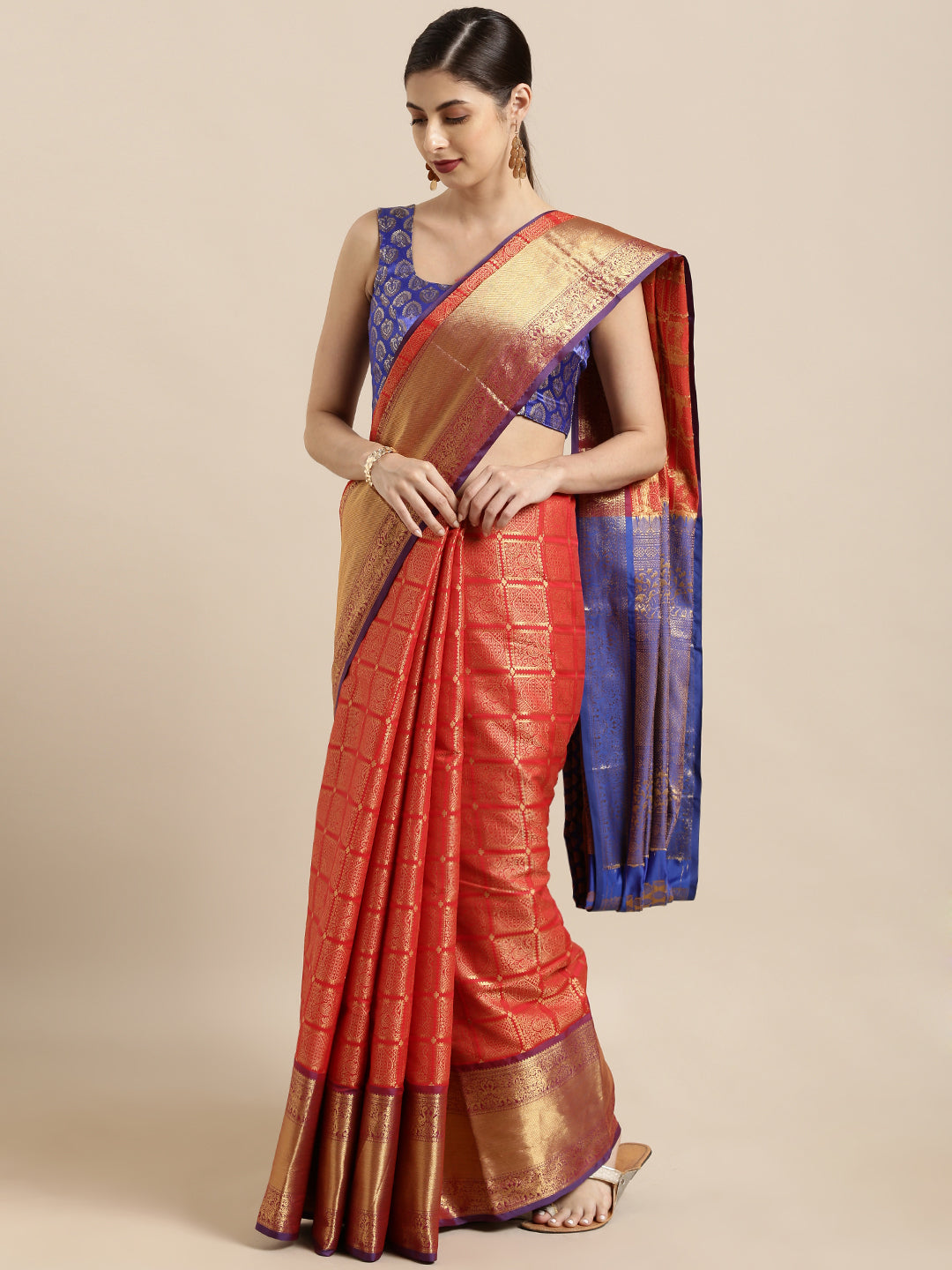 Model wearing red Kanjivaram silk saree with checked print