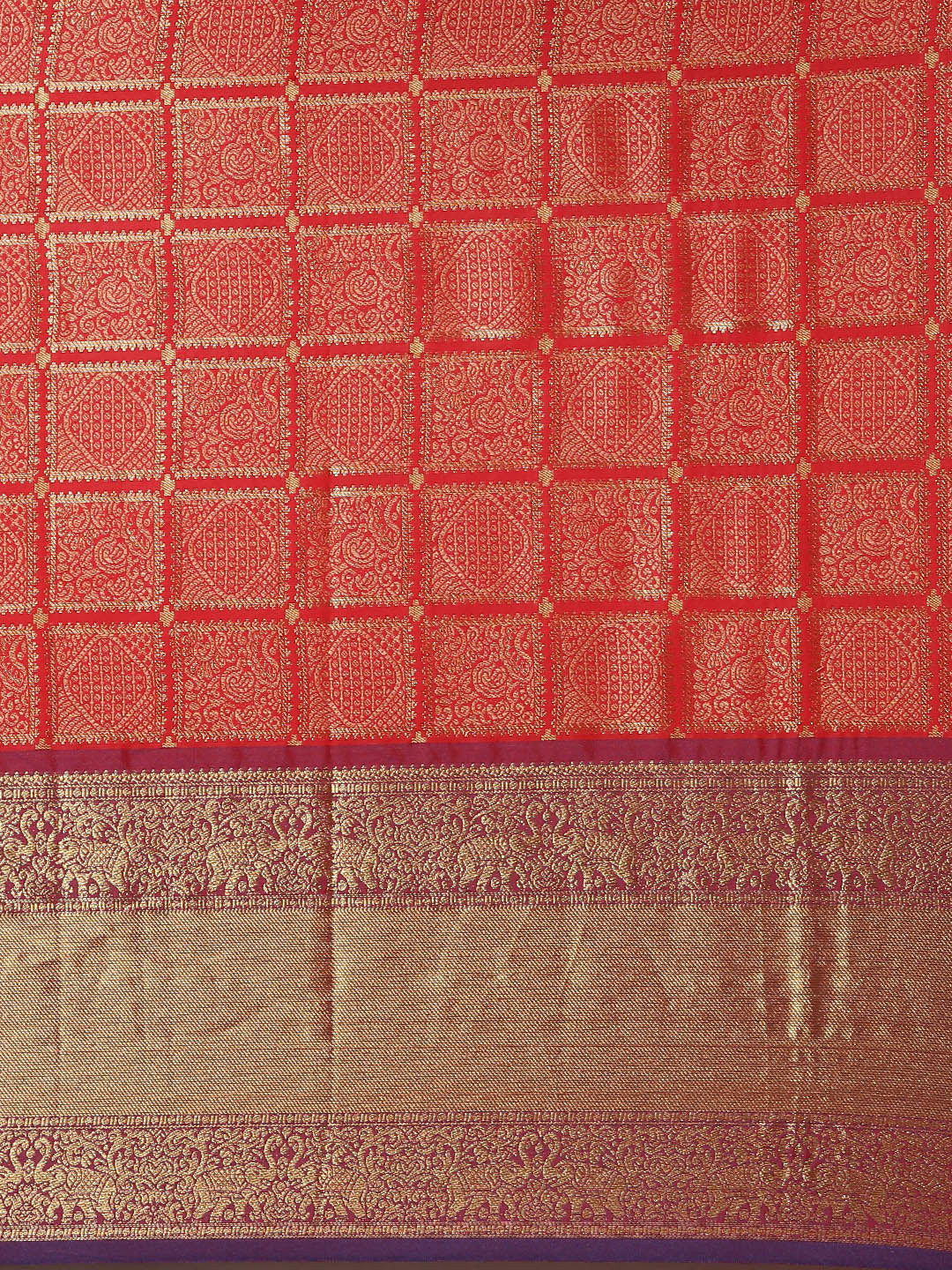 Detailed view of red checked print on Kanjivaram saree