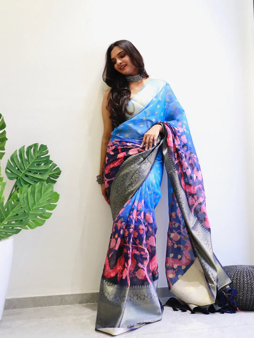 Blue and pink Kalamkari printed Kota Doriya saree draped elegantly.