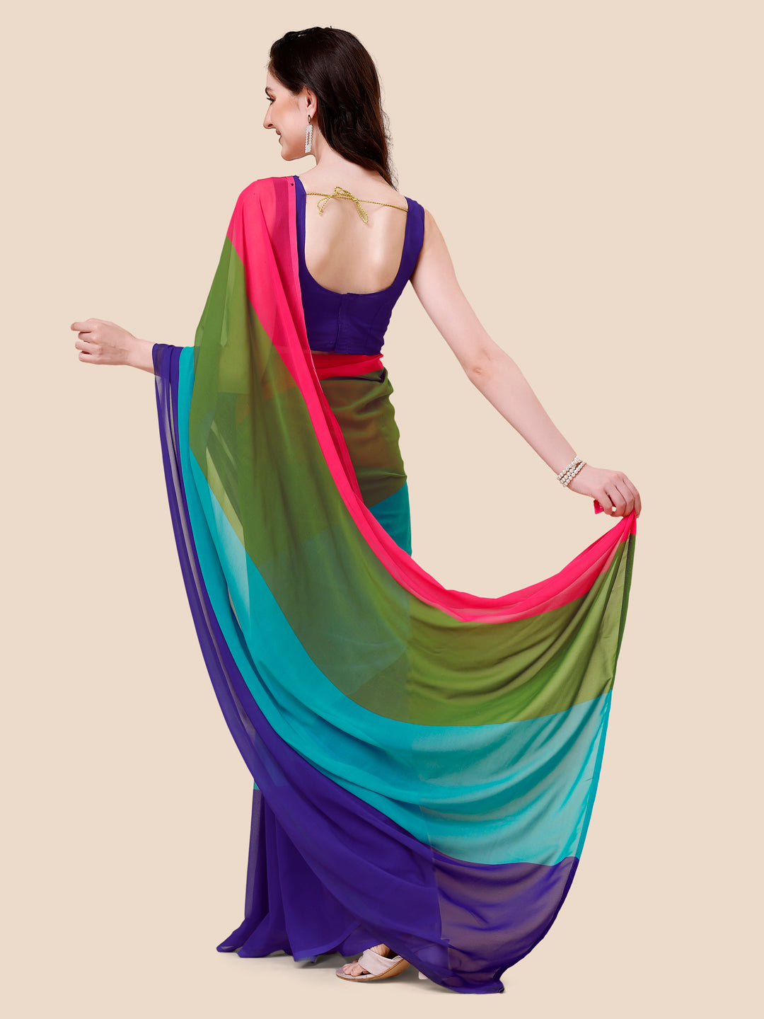 Back view of ombre saree showcasing flowing design