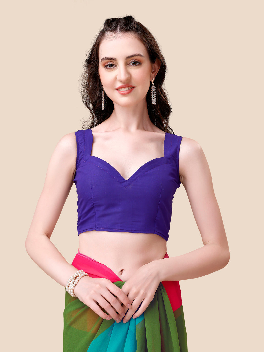 Model in purple blouse and vibrant ombre saree