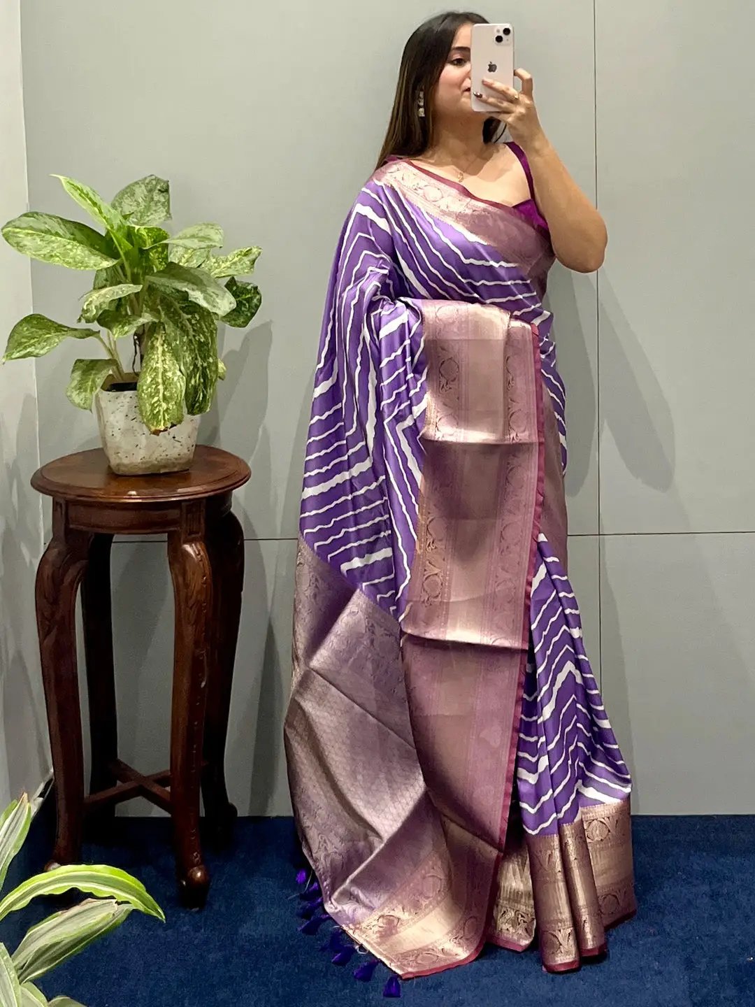 Woman in purple leheriya saree with Kanchi zari border.