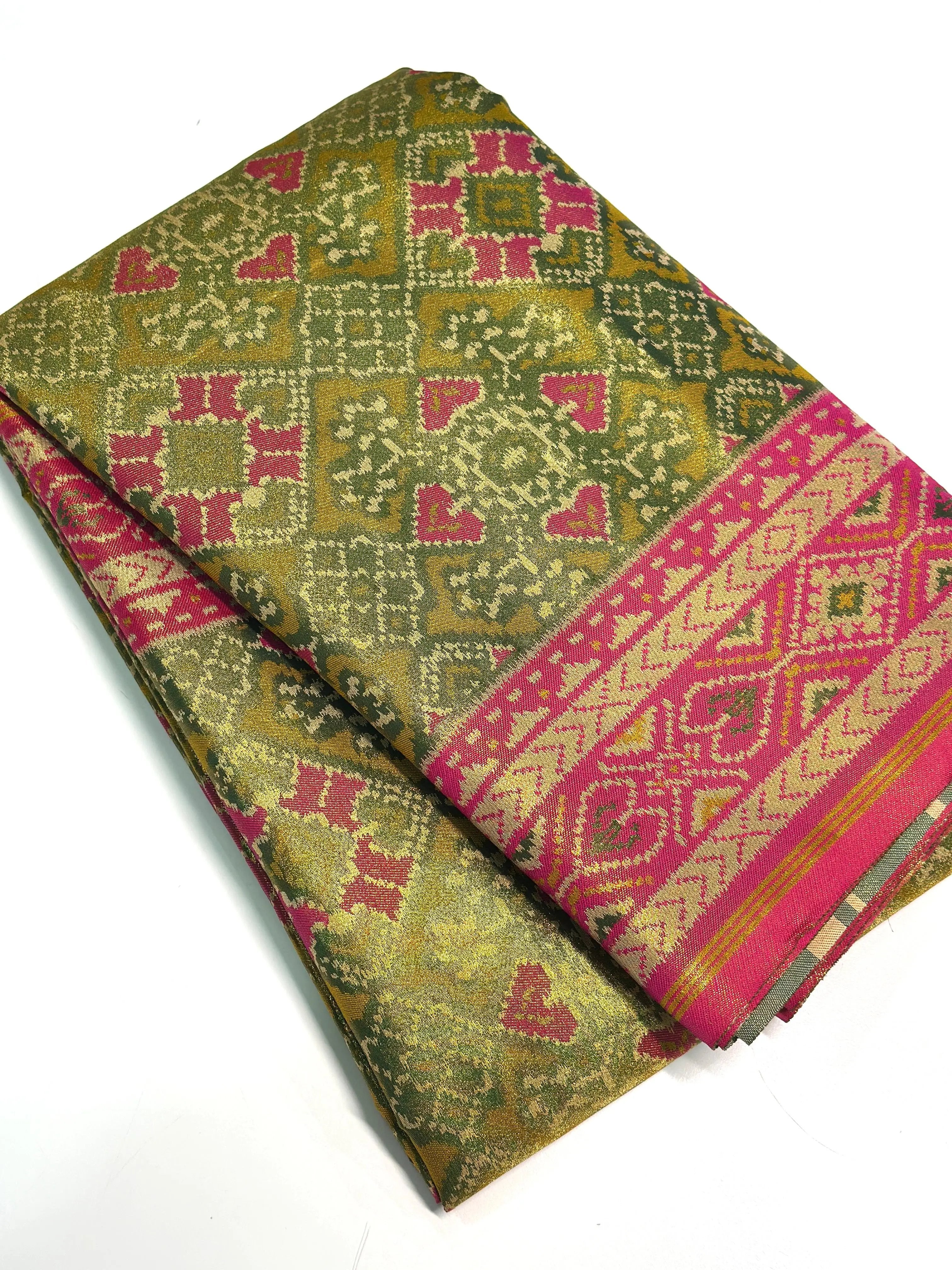 Mendi Green Double Ikkat Semi Silk Patola with intricate patterns